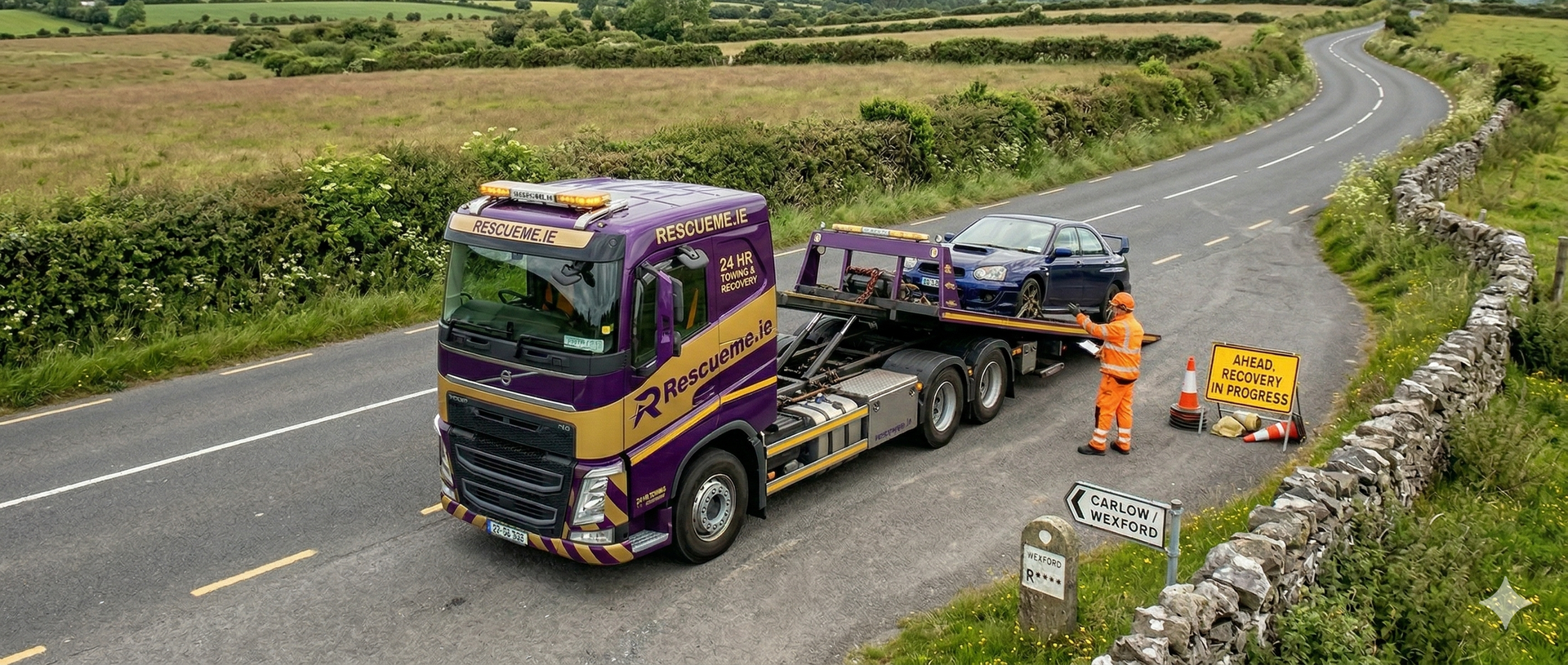 Tow truck assisting broken down car on R737 Wexford near Ramsgrange and Duncannon