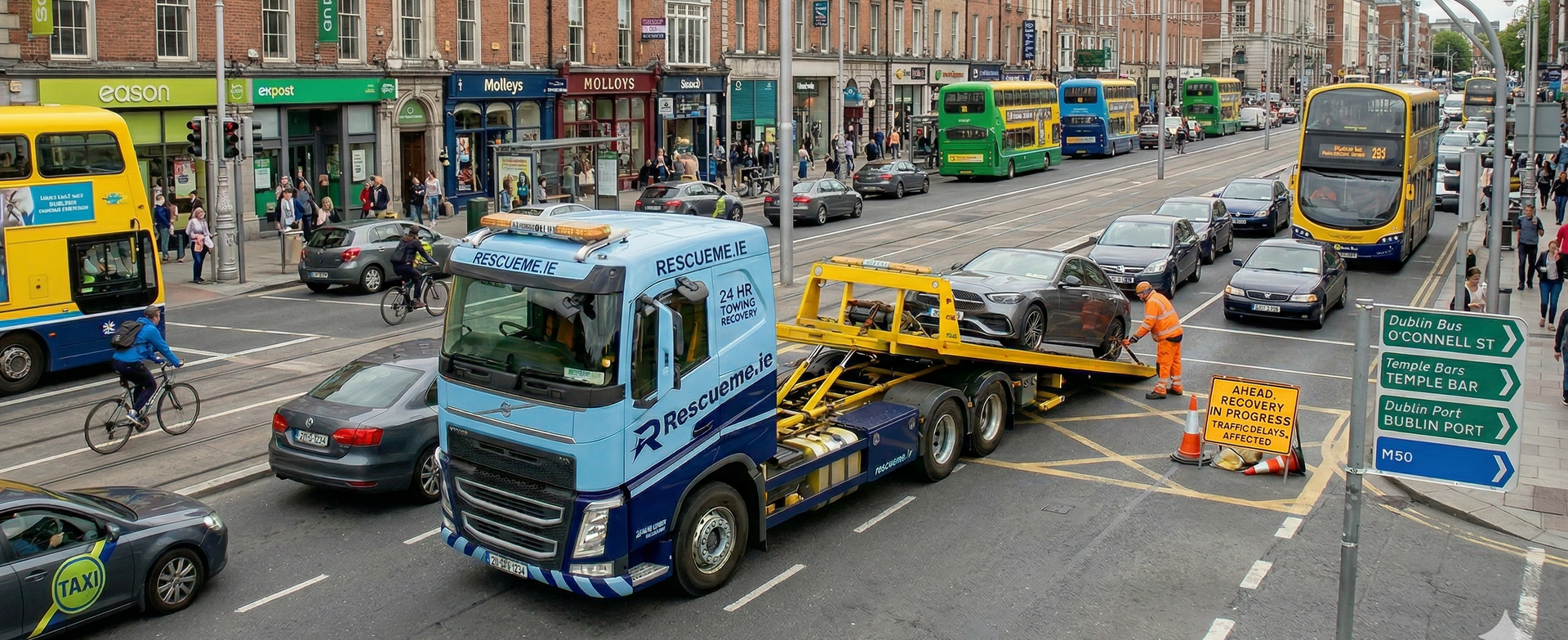 Tow truck assisting broken down car on N32 from Malahide Road to Dublin Port Tunnel