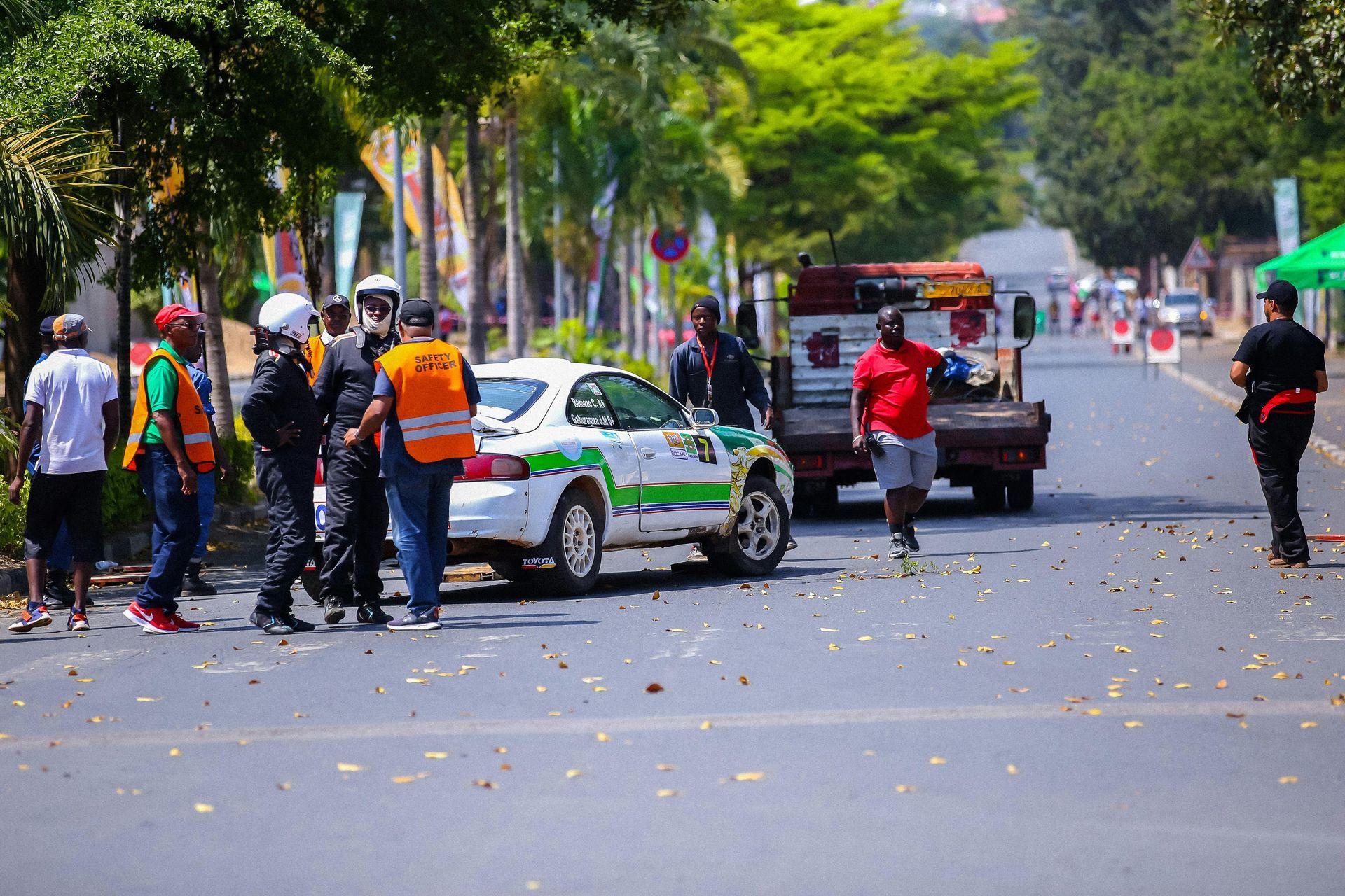  a tow truck surrounded by people