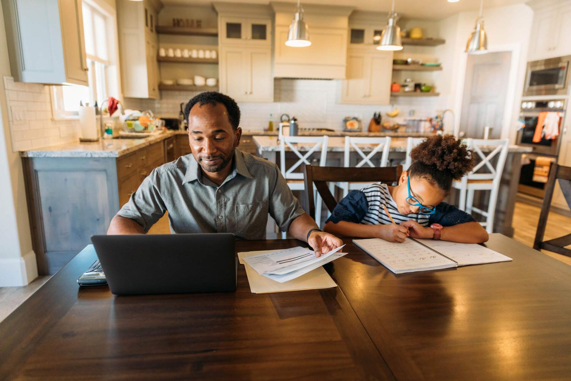 Father and daughter doing work next to each other — Jacksonville, FL — Beaches Family Law