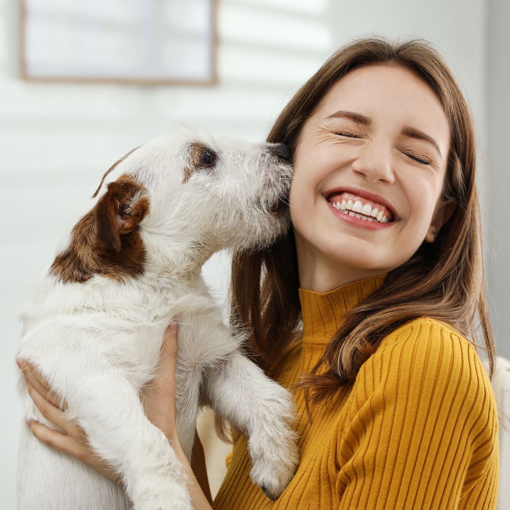 A Happy Dog Owner and Her Dog