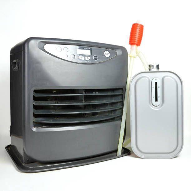 Grey kerosene heater with fuel tank and red pump.
