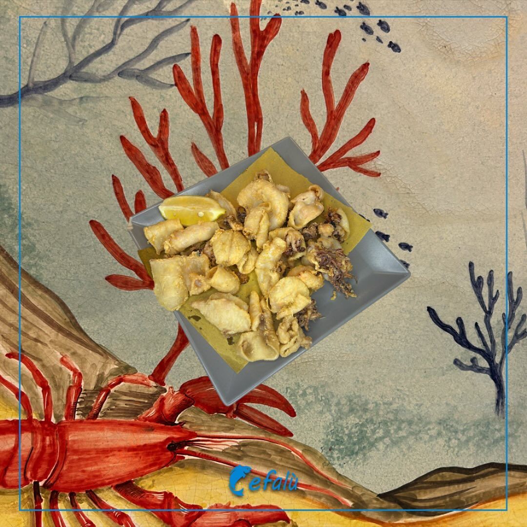 Un dipinto di un'aragosta e un piatto di cibo