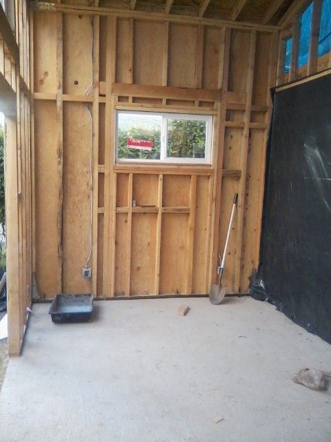 A Wooden Wall With A Window -  Los Angeles, CA - New Castle Remodeling