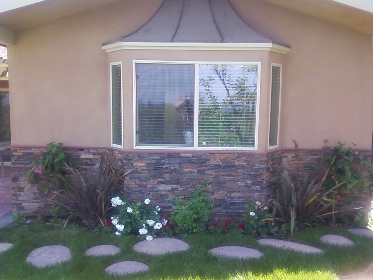 A House With A Bay Window And A Stone Wall -  Los Angeles, CA - New Castle Remodeling