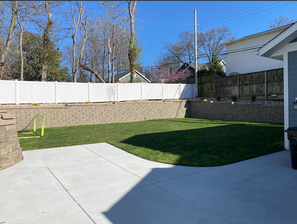 Hardscape patio and grass with retaining wall | St. Charles MO