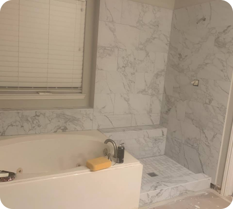 A bathroom with a tub, shower and window.