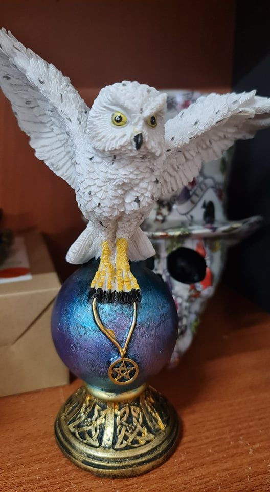 Owl statue on vase