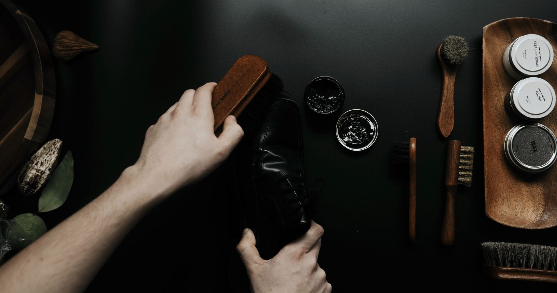 shoe polish, brushes and leather conditioner keeping safety boots clean to improve durability