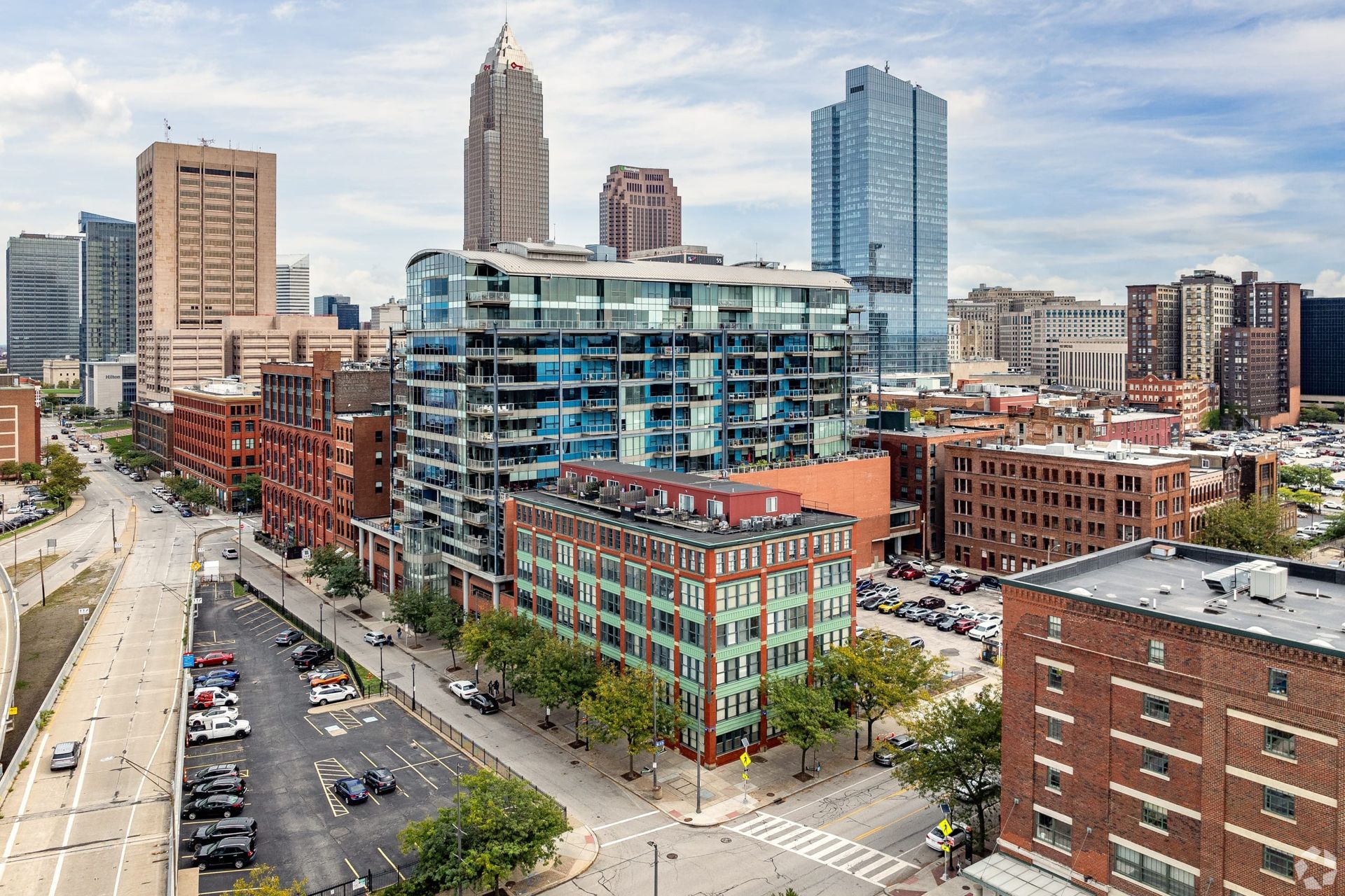 An aerial view of a city with a lot of buildings and trees.