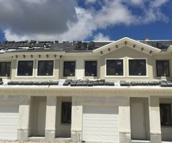 A house with a roof that is being installed