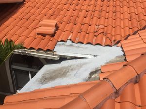 A roof with a hole in it and a window