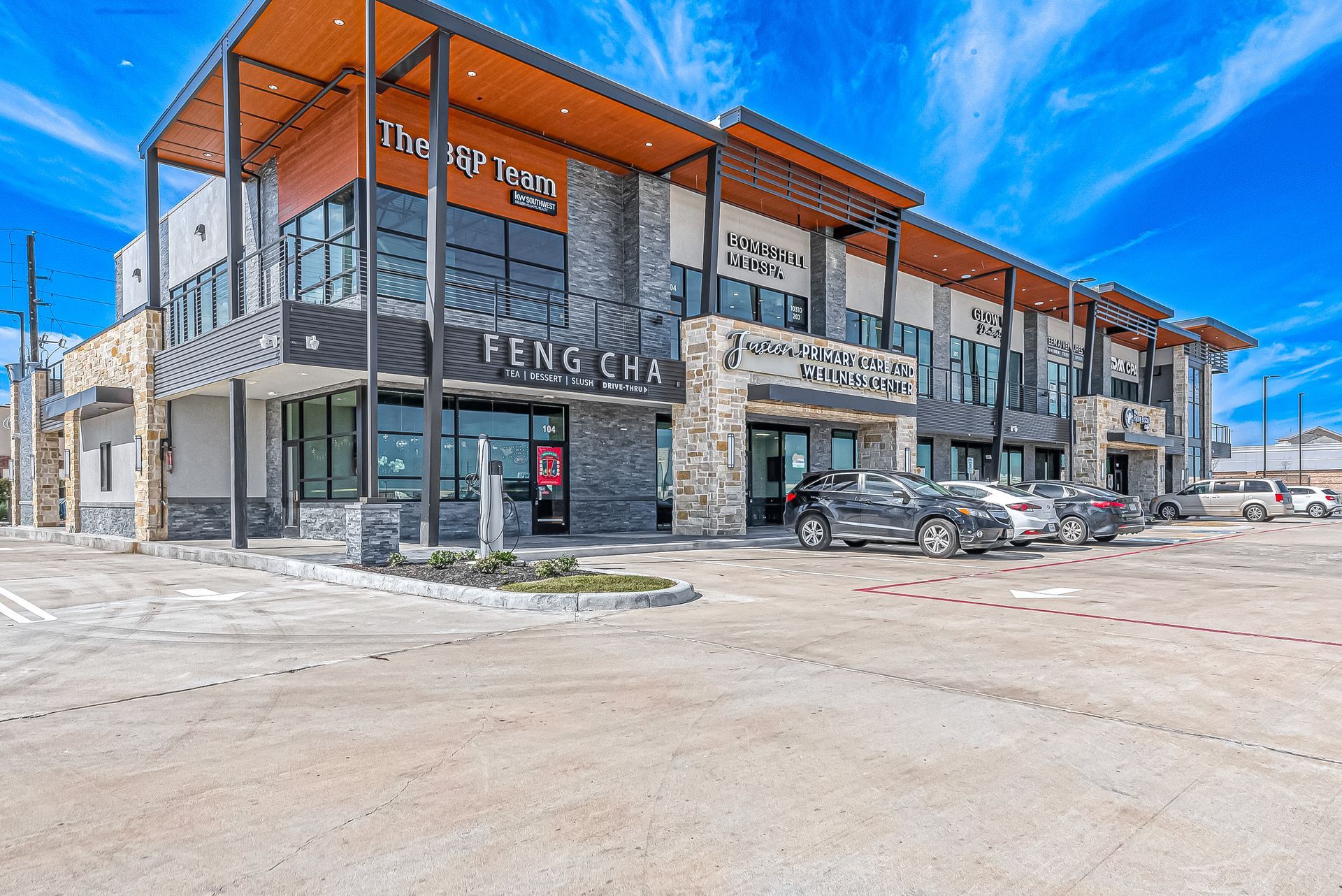 A large building with cars parked in front of it.