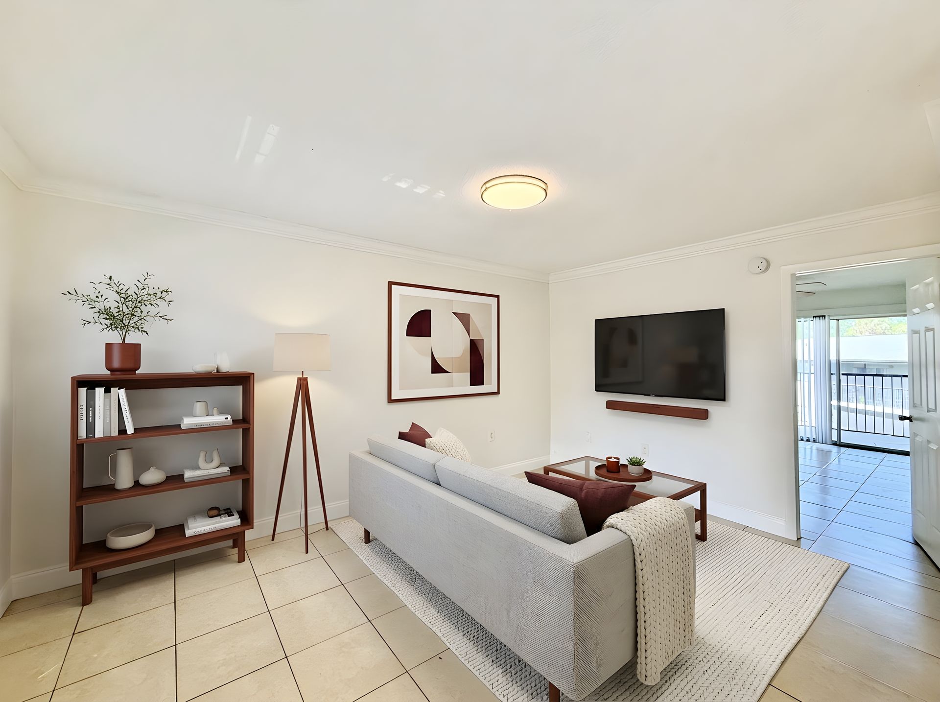 Staged living room with tile floors and sofa set