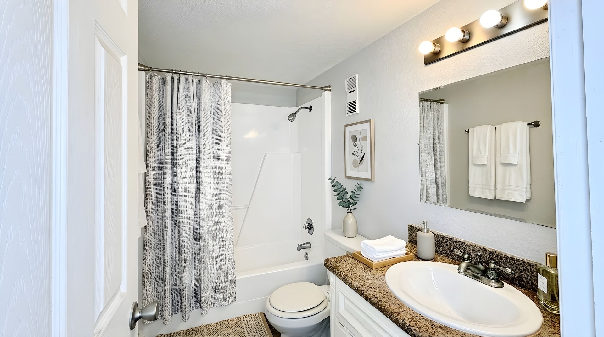 Staged full bathroom with tub/shower combo