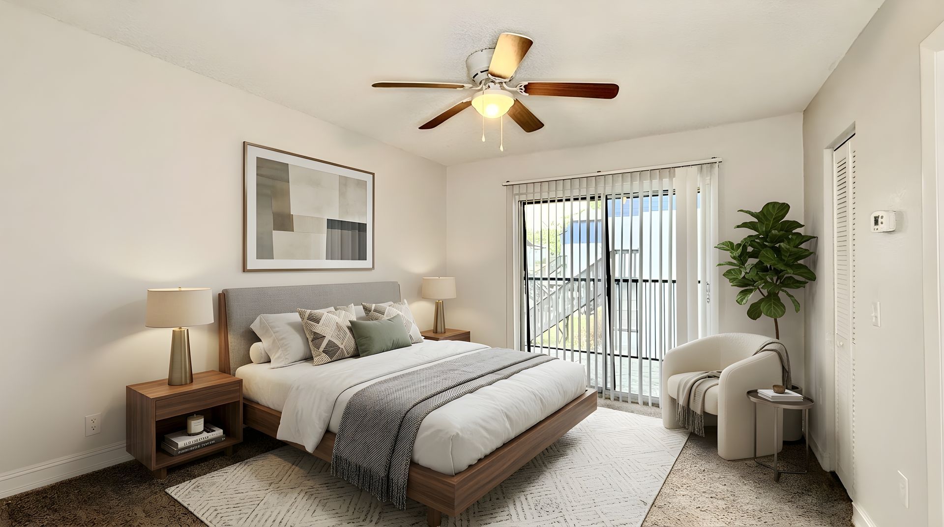 Staged bedroom with large sliding doors and carpet