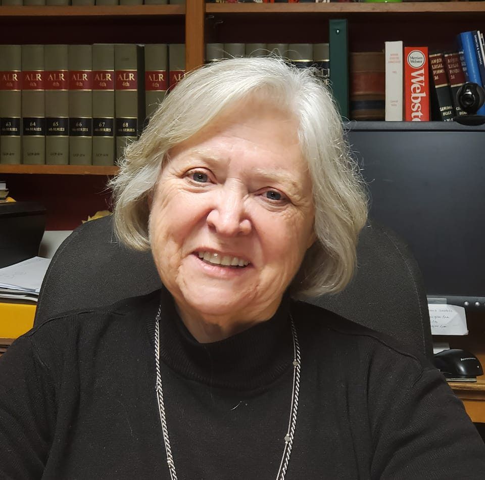 Portrait of Sally sitting in her office