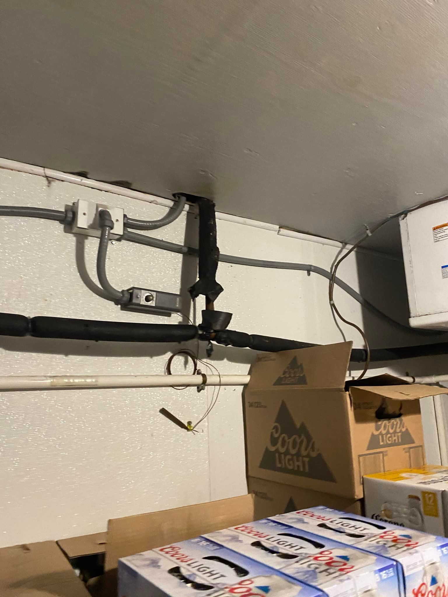 A warehouse filled with boxes of coors light beer.