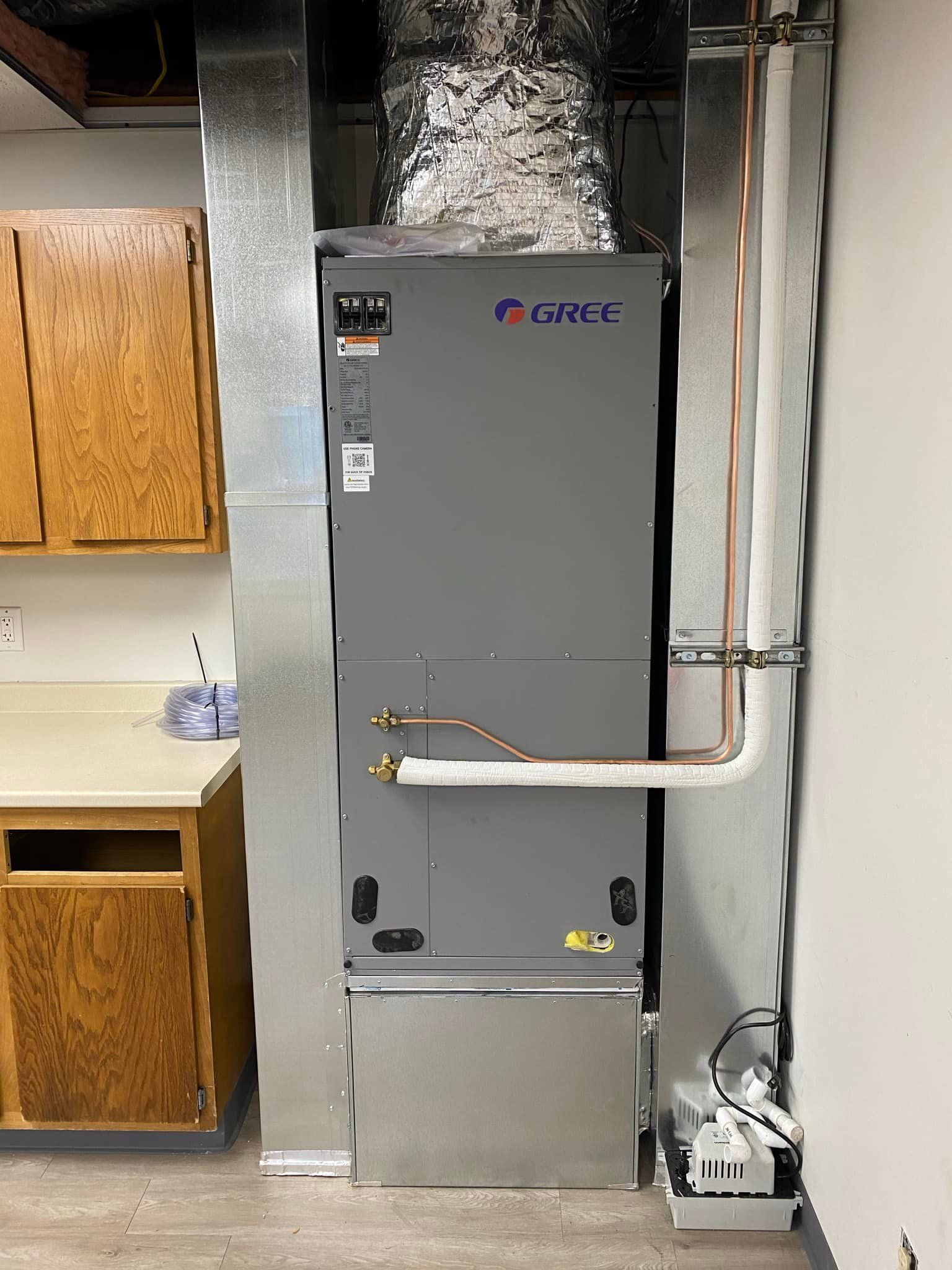 A heating and cooling system is installed in a kitchen.