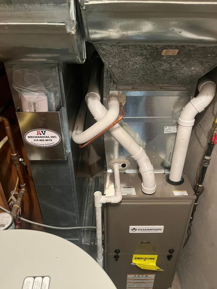 A picture of a heating and cooling system in a basement.