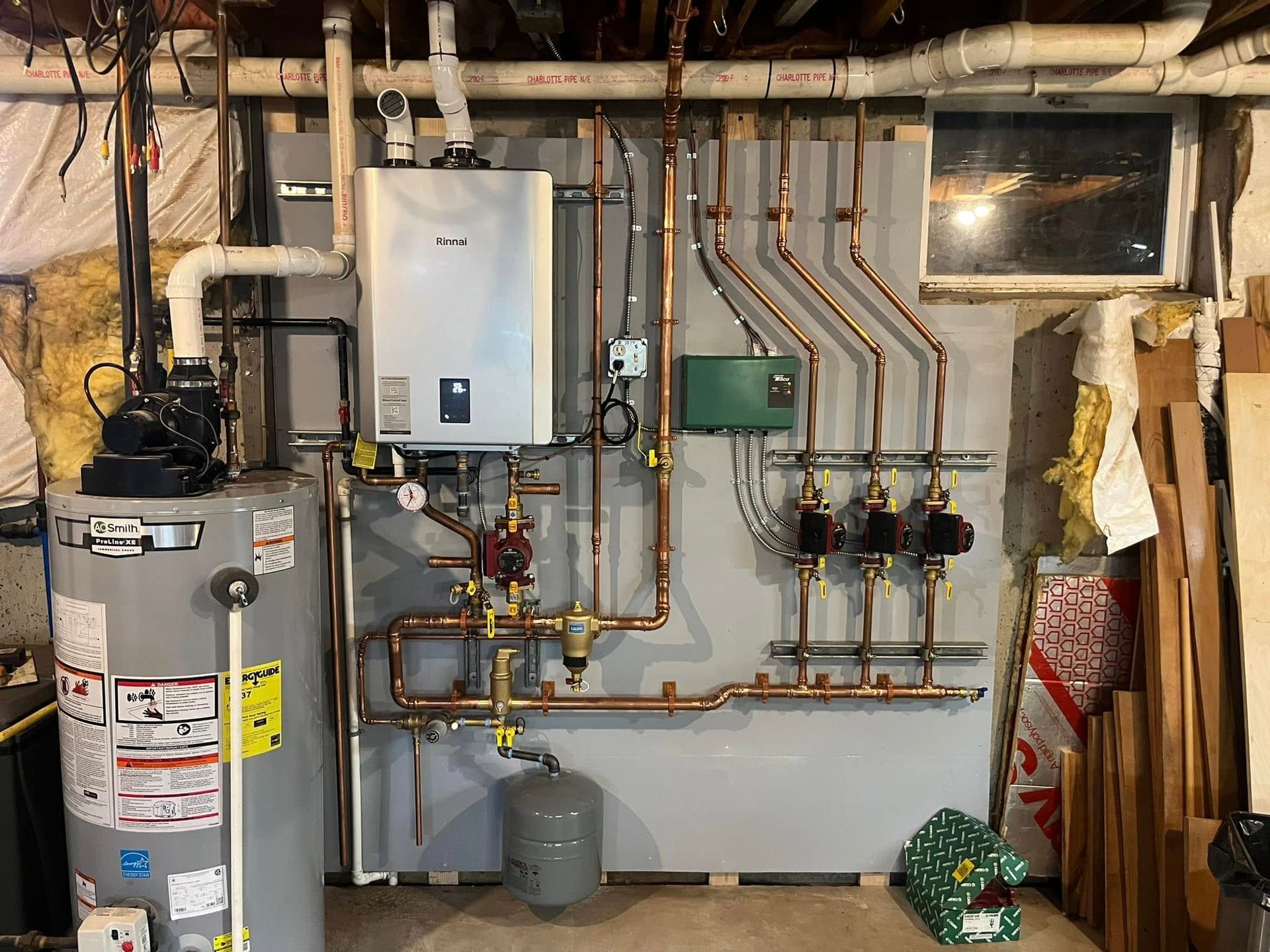 There is a water heater and a boiler in the basement.