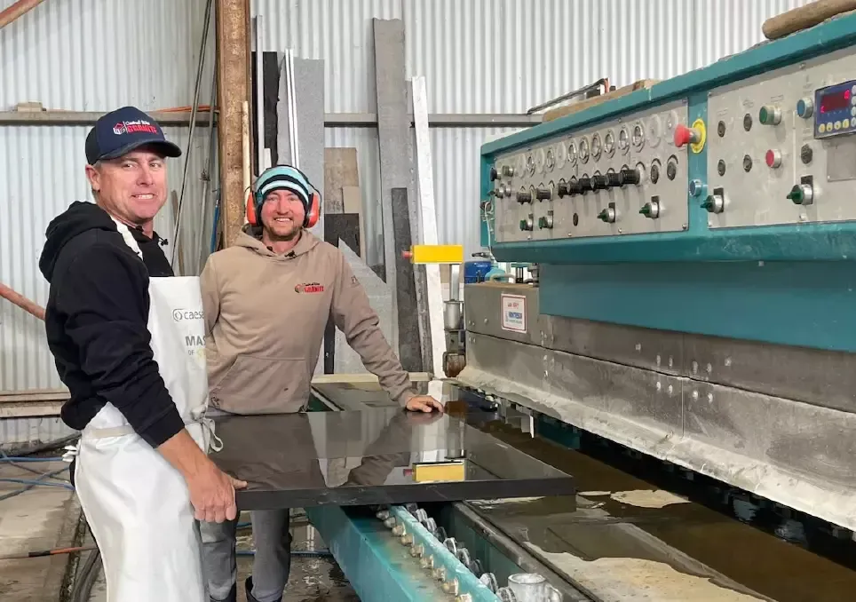 A warehouse filled with lots of different colored marble slabs.