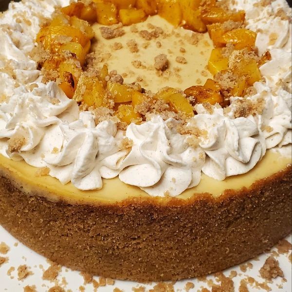 A cheesecake with whipped cream and pineapple on top