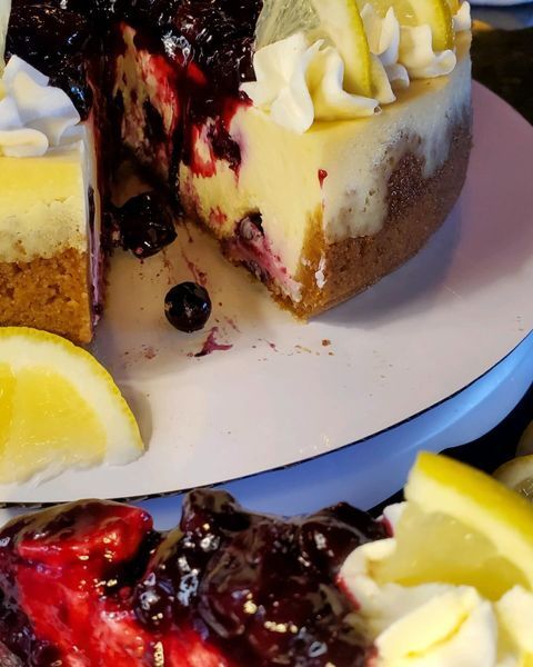 A cheesecake with a slice taken out of it