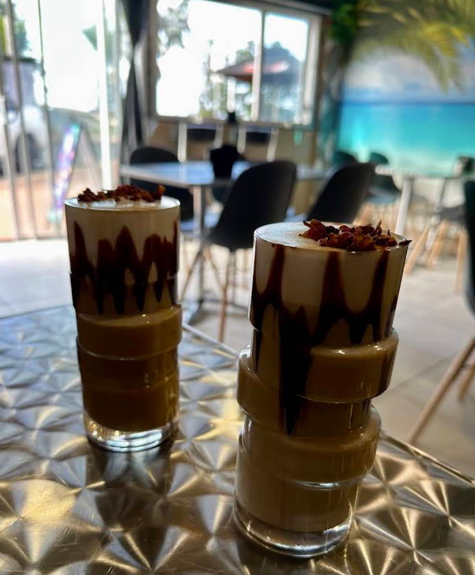 Two Layered Iced Coffees With Chocolate Drizzle and Toppings — Relax in Paradise in Yeppoon, QLD
