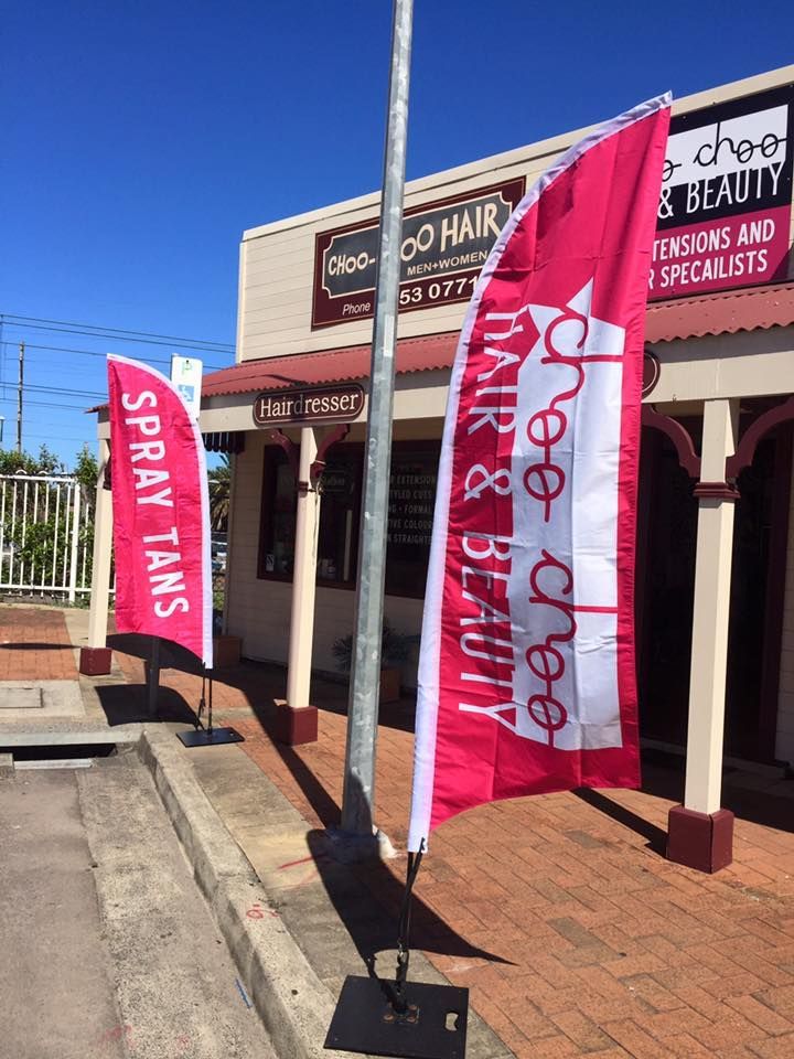 Two Pink Flags Outside a Salon — Stuckup Industries in Morisset, NSW
