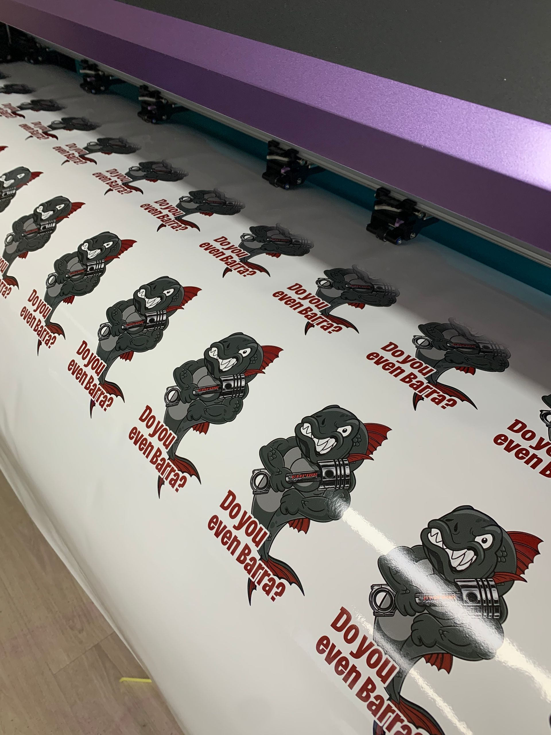 Printed sheet with repeating cartoon-style seal graphics and the text 