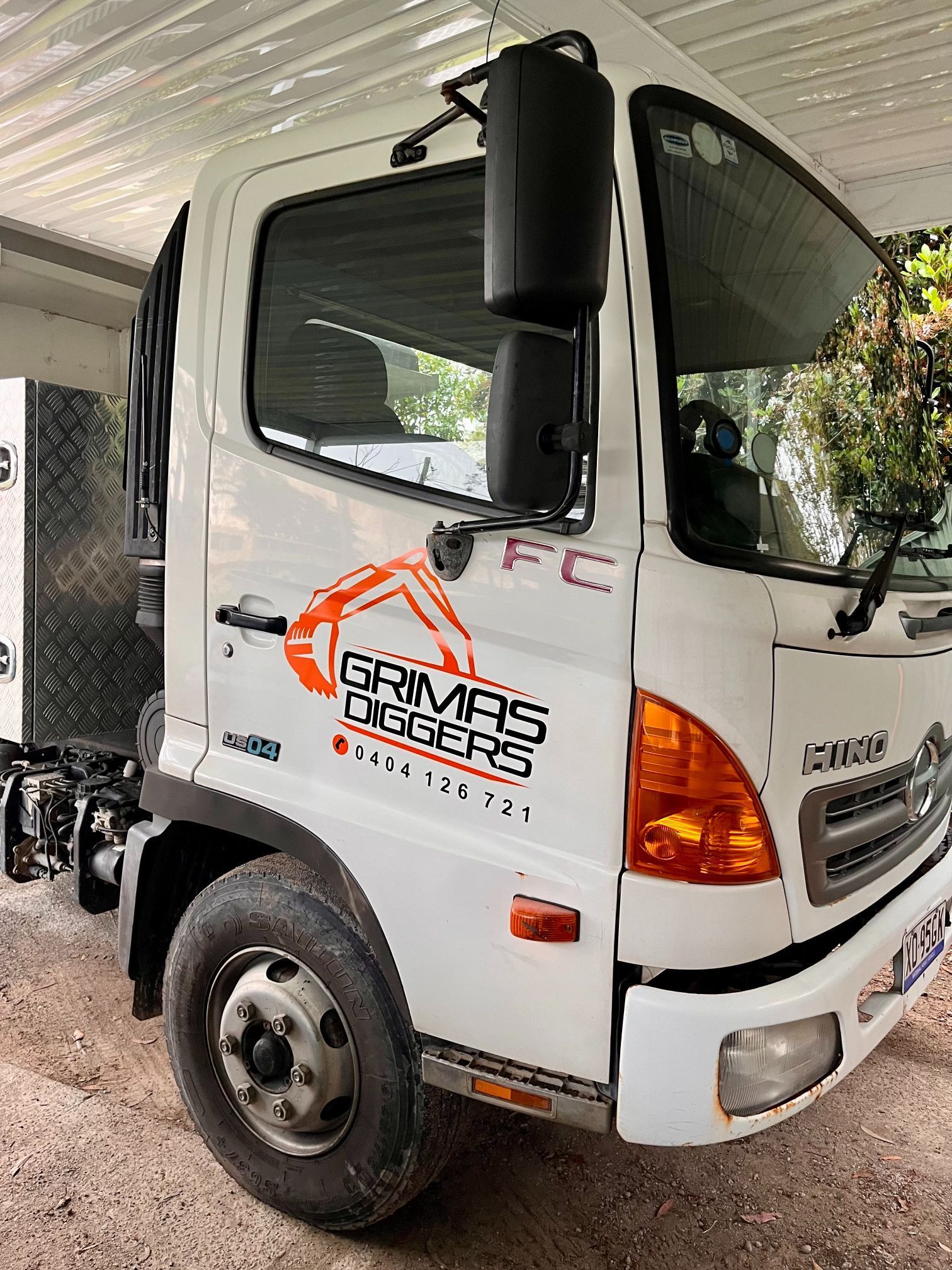 White Hino Truck with A Sticker on The Side — Stuckup Industries in Morisset, NSW