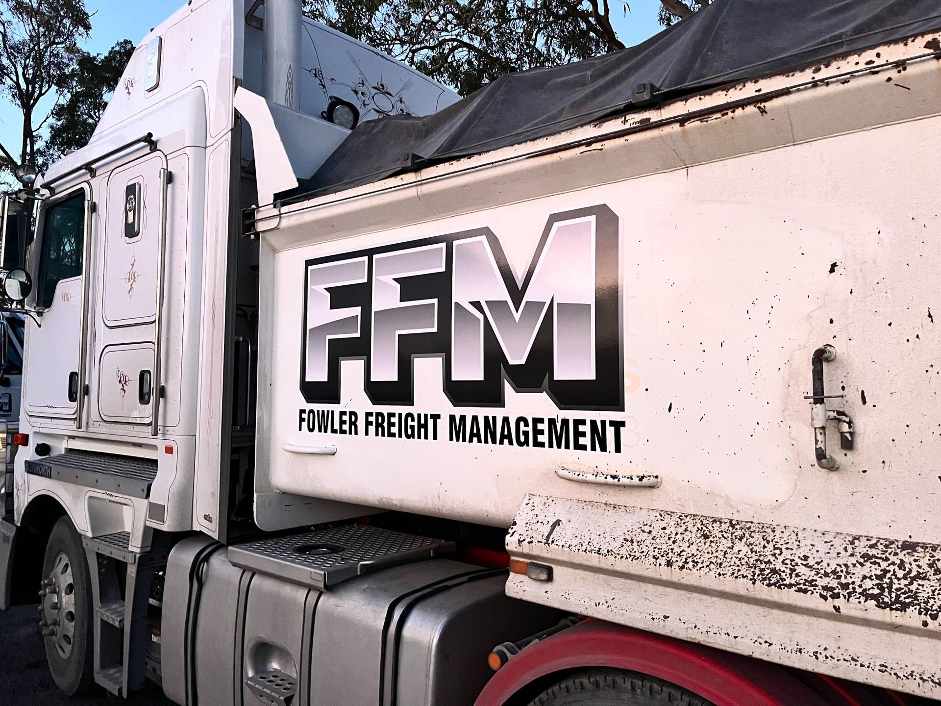 White Fowler Freight Management semi-truck with the company logo on the side — Stuckup Industries in Morisset, NSW