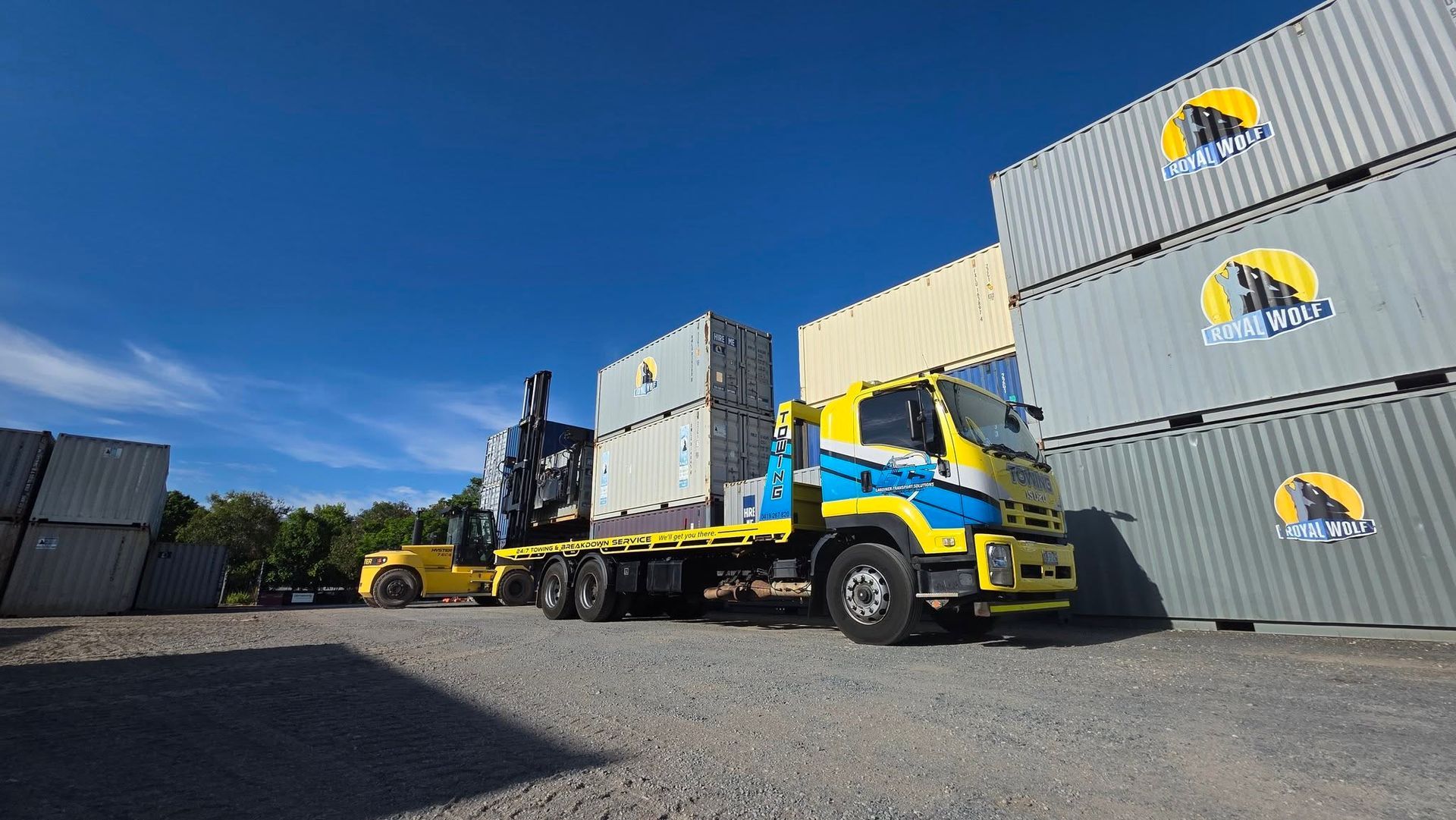 Truck with cargo containers being loaded by a forklift — GTS - Gardiner Transport Solutions in Berserker, QLD