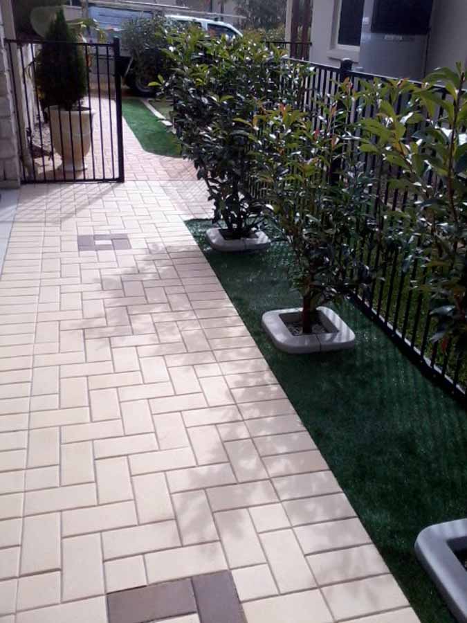 artificial grass and pavement
