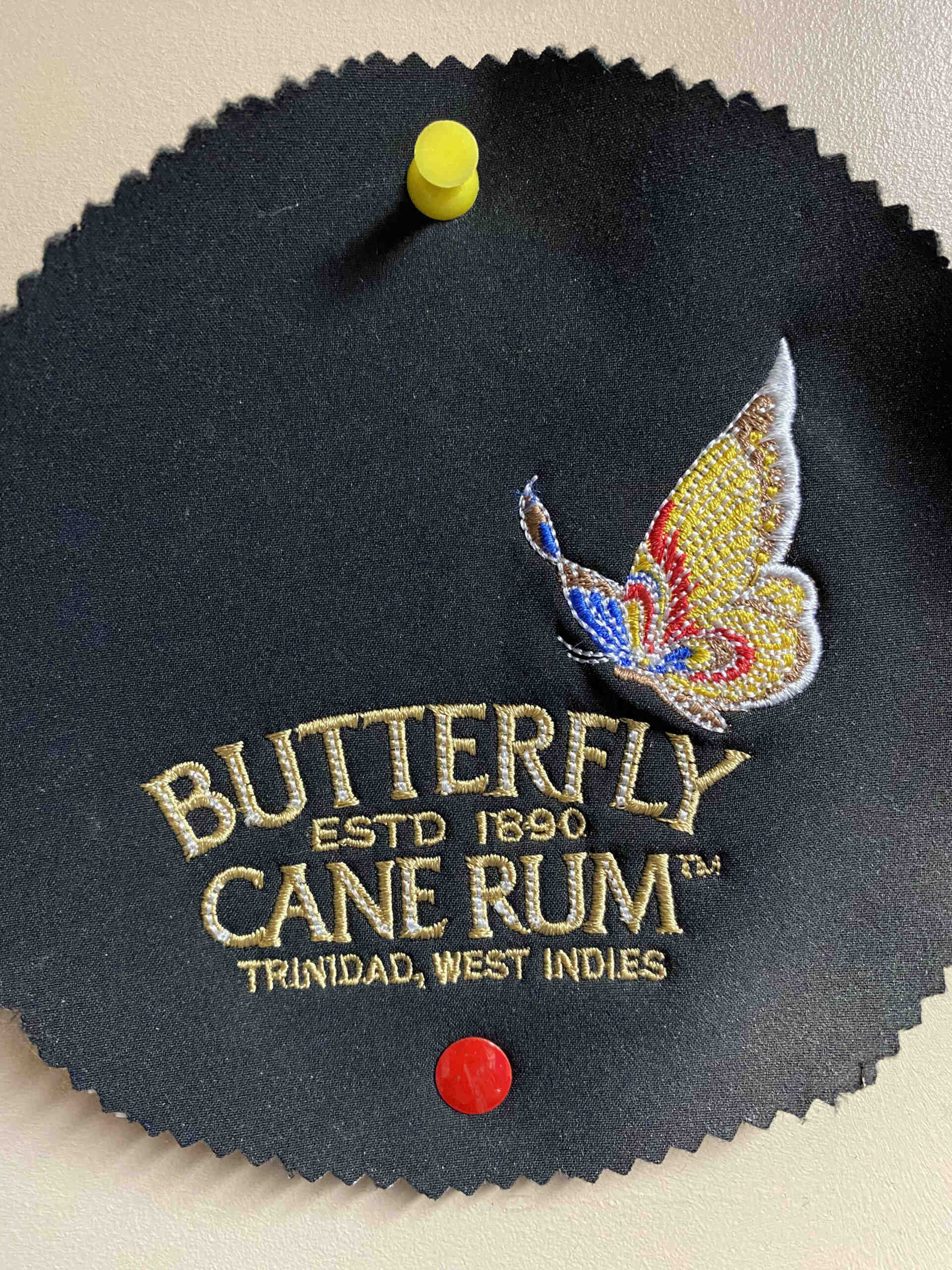 Black fabric patch with embroidered butterfly and