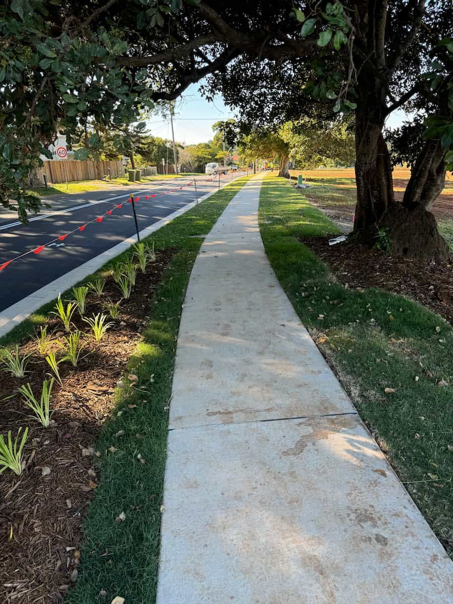 A Sidewalk Leading To A Street With Trees On Both Sides — J & M Bashforth & Sons In Northern Rivers, NSW