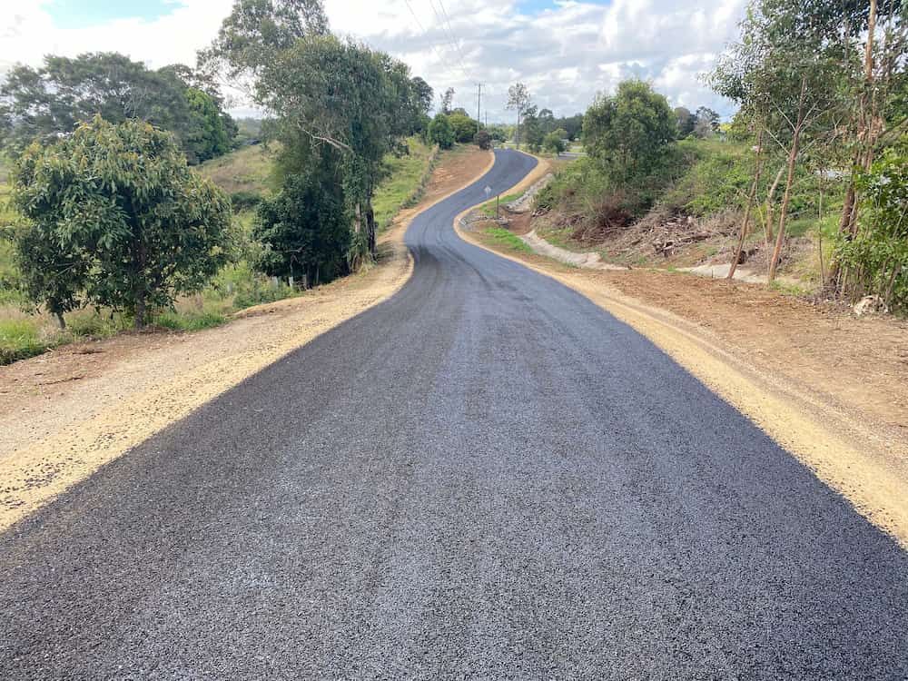 A Curvy Road With Trees On The Side Of It — J & M Bashforth & Sons In Brunswick Heads, NSW