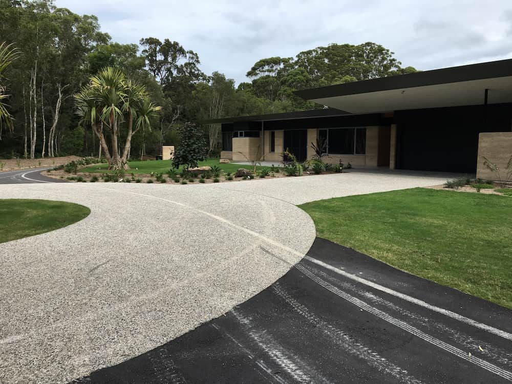 A Driveway Leading To A House With Trees In The Background — J & M Bashforth & Sons In Brunswick Heads, NSW