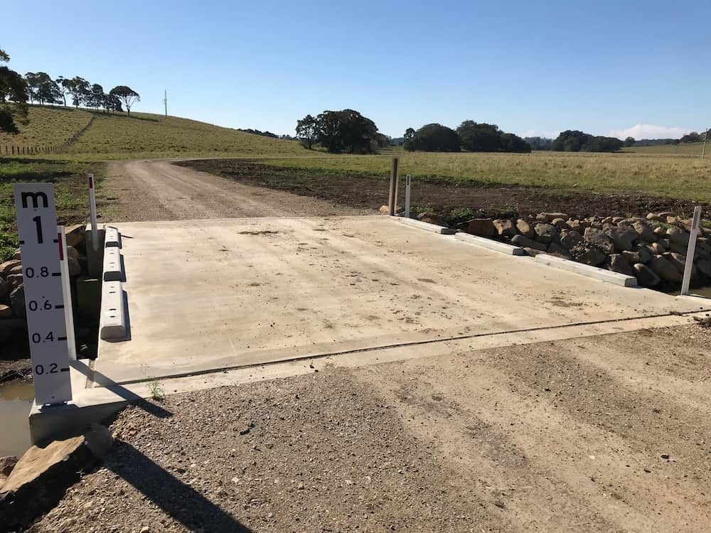A Dirt Road With A Sign That Says M On It — J & M Bashforth & Sons In Brunswick Heads, NSW