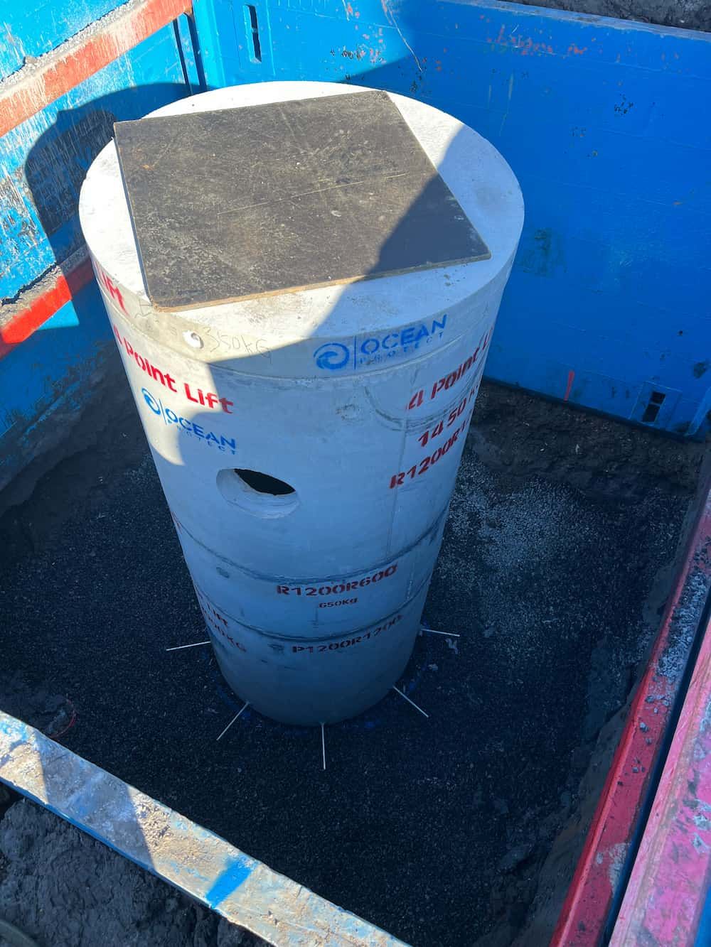 A White Cylinder Is Sitting On Top Of A Blue Box — J & M Bashforth & Sons In Brunswick Heads, NSW