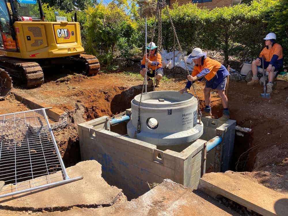A Group Of Construction Workers Are Working On A Septic Tank — J & M Bashforth & Sons In Brunswick Heads, NSW