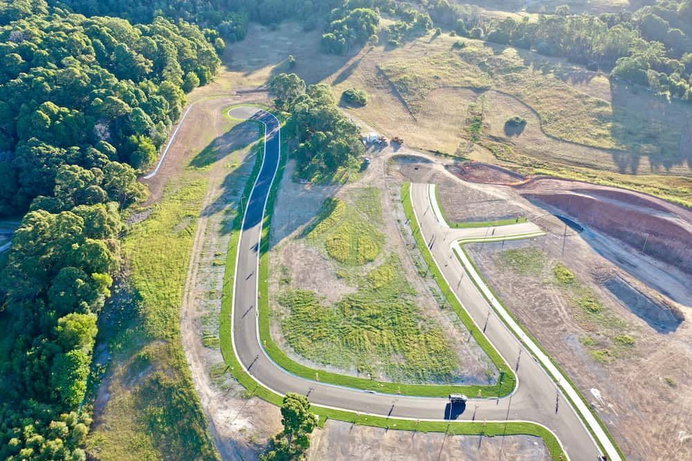An Aerial View Of A Residential Area Surrounded By Trees And Grass — J & M Bashforth & Sons In Brunswick Heads, NSW