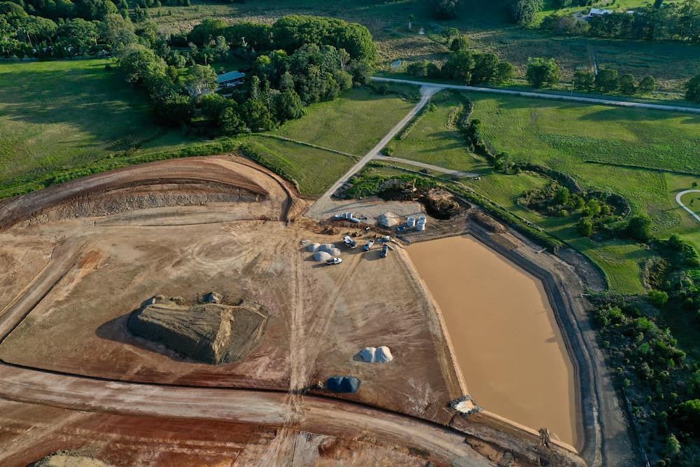 An Aerial View Of A Construction Site With A Lot Of Dirt And Trees — J & M Bashforth & Sons In Brunswick Heads, NSW