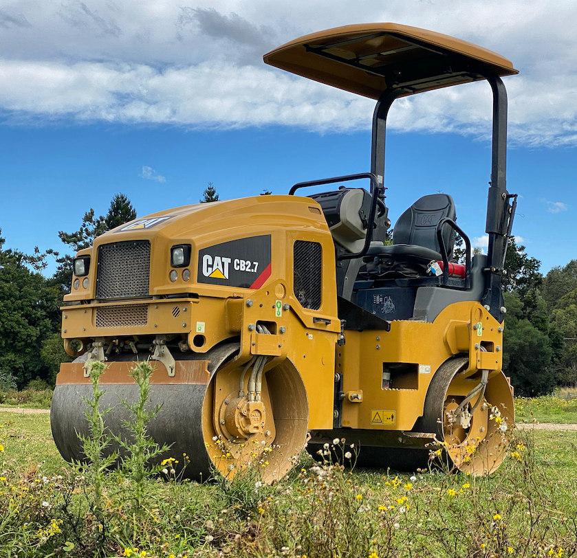 A Machine Roller On A Grass Field With Trees In The Background — J & M Bashforth & Sons In Brunswick Heads, NSW