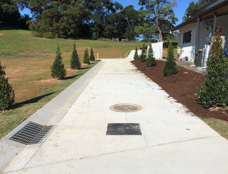 A White Drive Way With Trees To The Right -  J & M Bashforth & Sons In Brunswick Heads, NSW