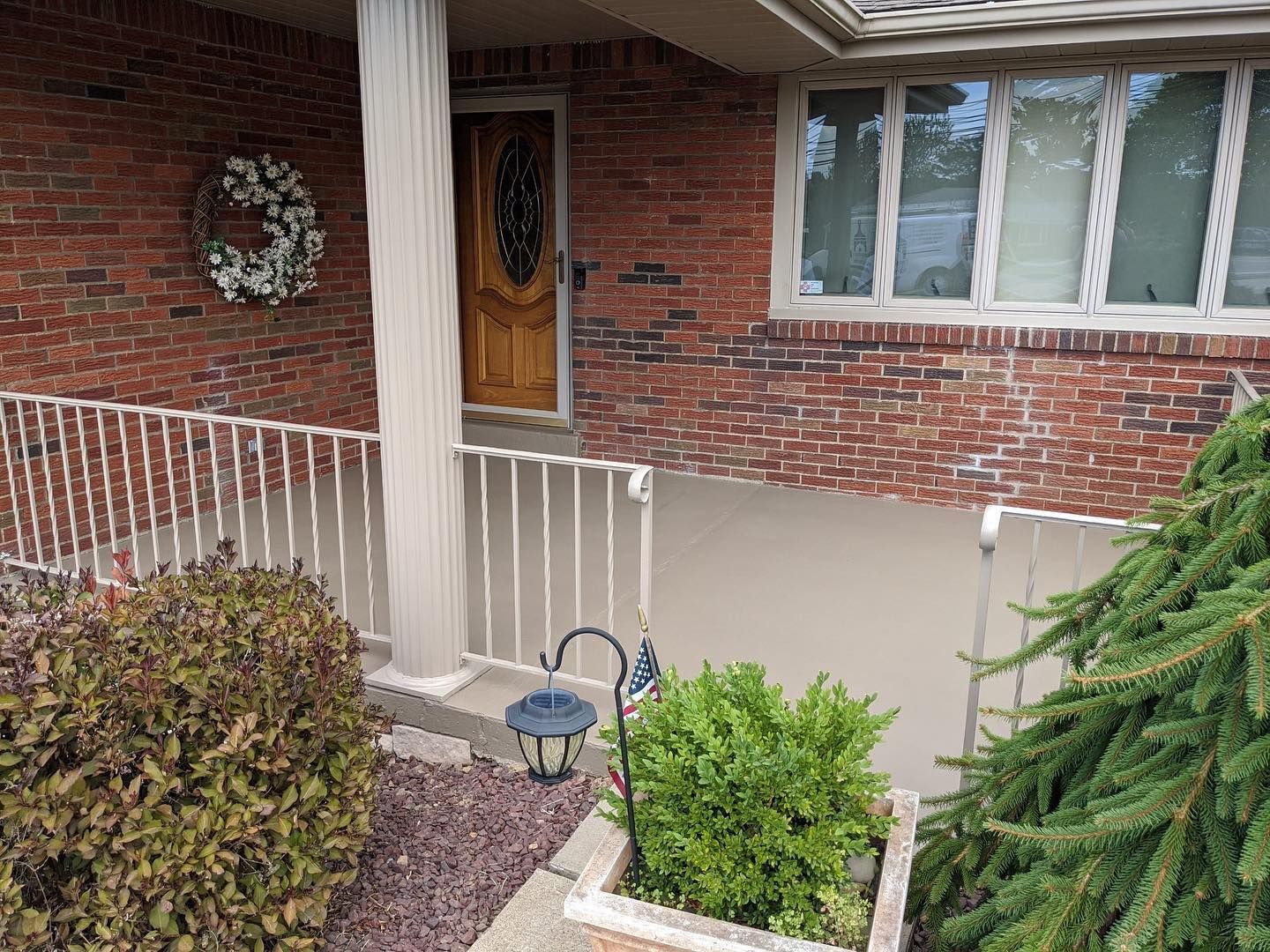 porch floor, pillars, railings and window trim painted by Obringers on the exterior of a Pittsburgh home