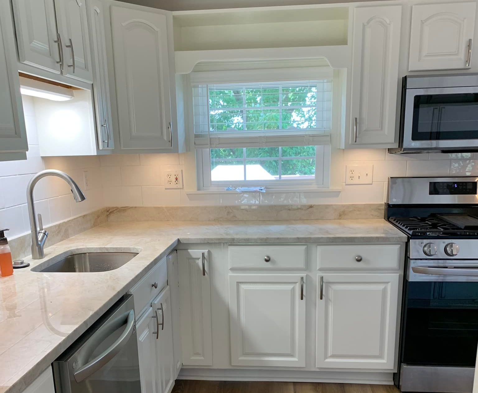 cabinets refinished white by Obringer's Painting and Remodeling