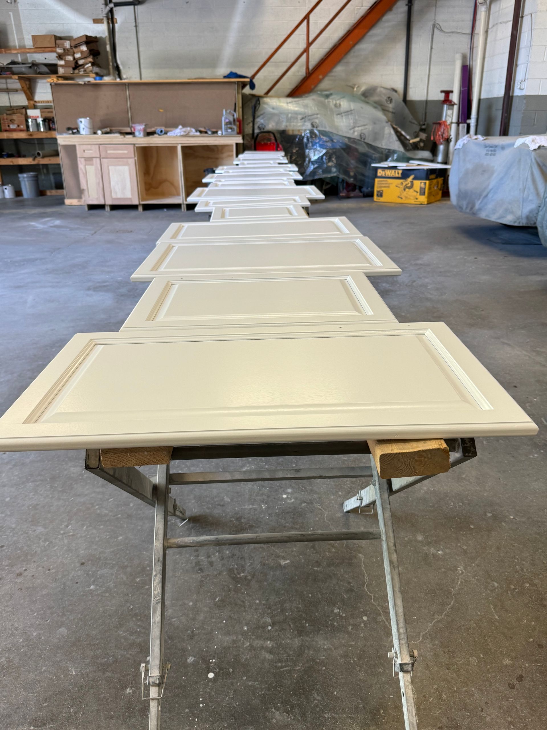 cabinet doors being refinished a cream color