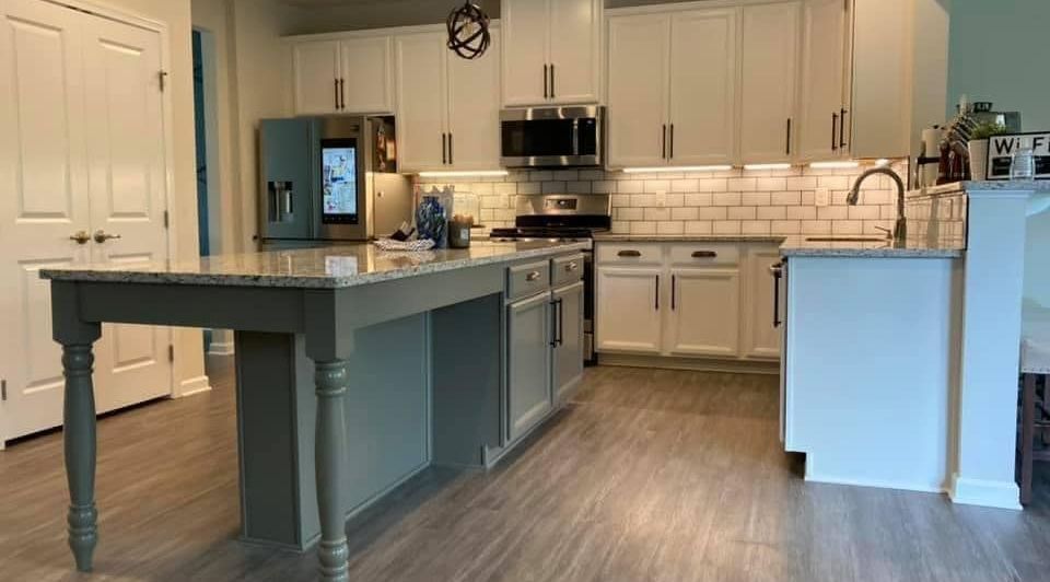 kitchen remodel with different colored island, tall white cabinets